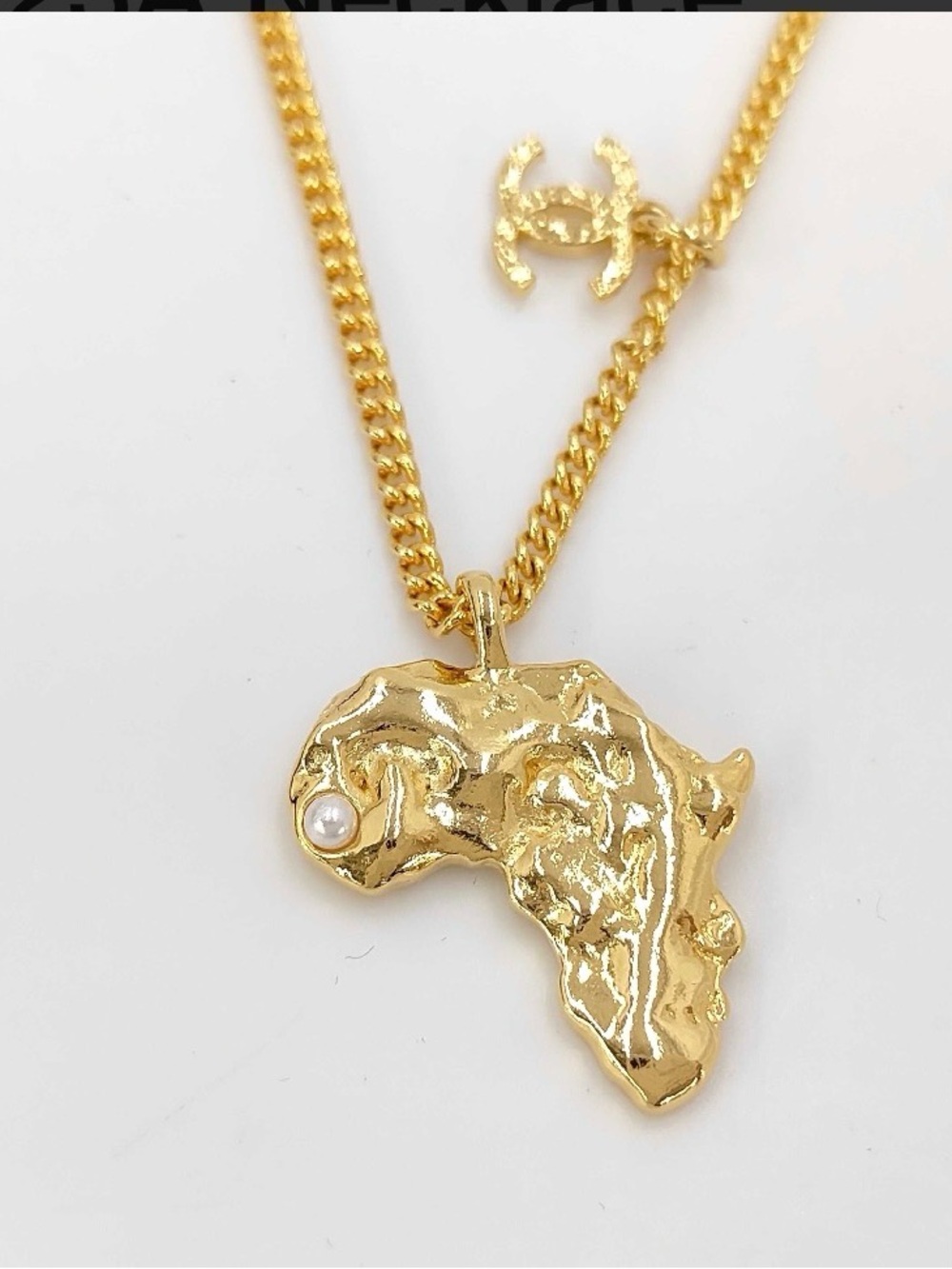 CHANEL Gold-Tone Africa Map Pendant Necklace with Pearl Detail